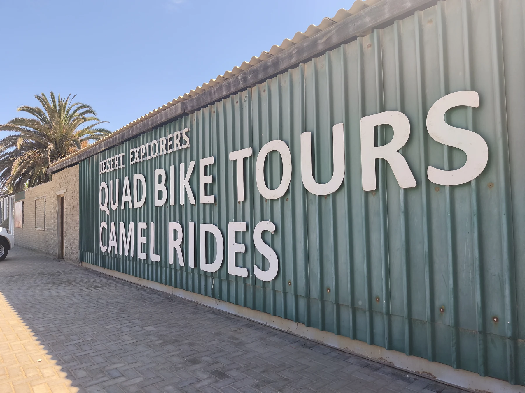 Quad Bike Tours and Camel Rides sign at Desert Explorers