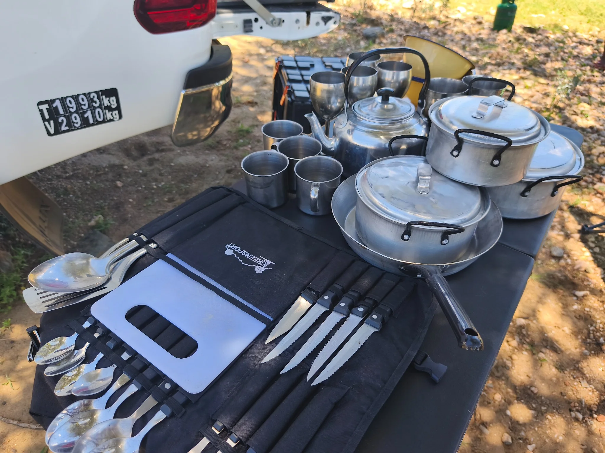 Camping kitchen equipment supplied with the Toyota Hilux Camping including pots, pans, kettle, cups, cutlery and cooking utensils