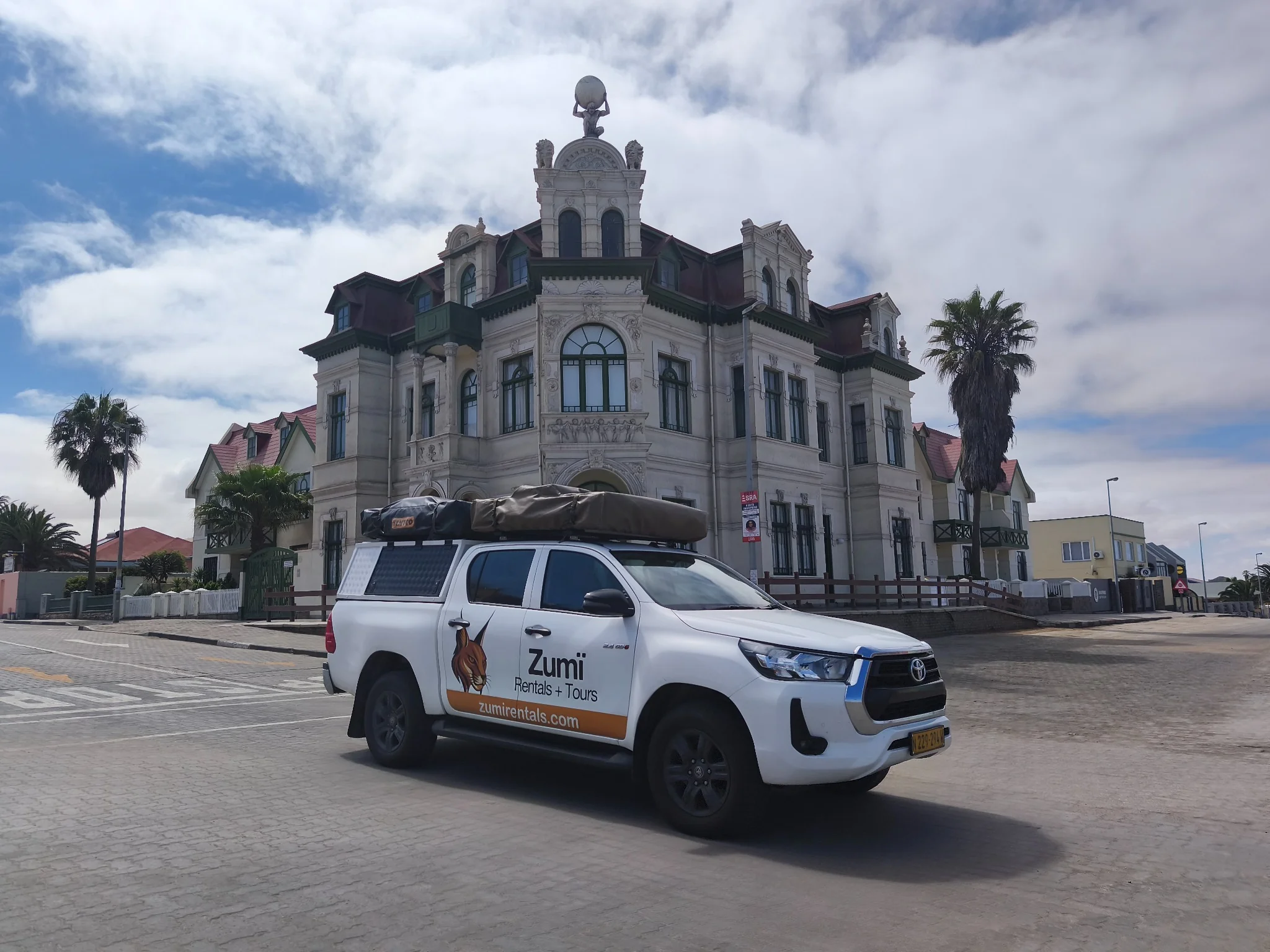 Toyota Hilux Camping by historic Swakopmund architecture